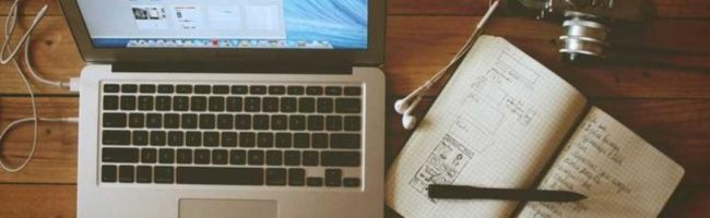 A notebook and coffee on a desk, symbolising transparent costs and sustainable stewardship without pressure.